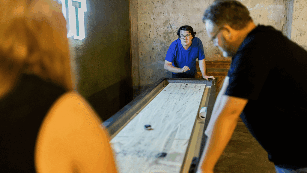 Image of guests playing games in the Dugout Sports Bar at Cedar Court Huddersfield - Photography by John Steel.