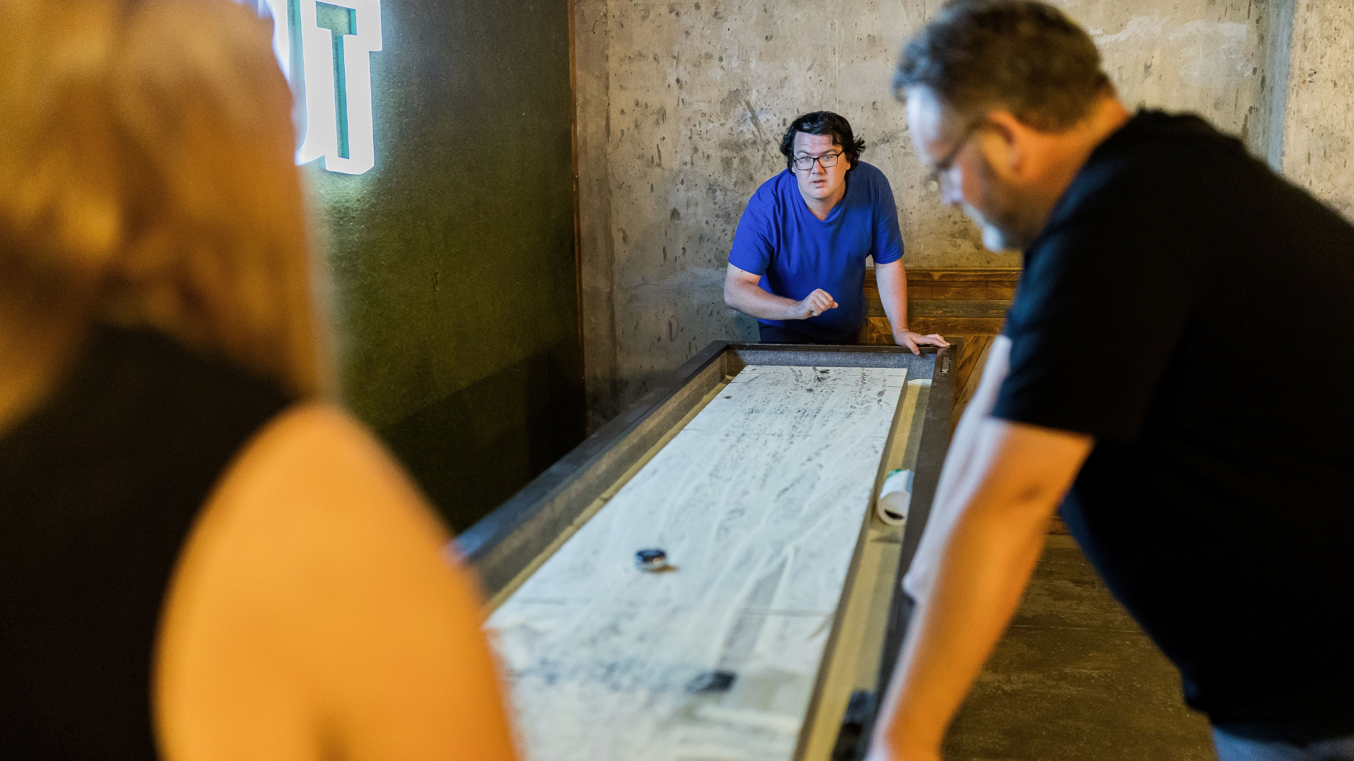 Image of guests playing games in the Dugout Sports Bar at Cedar Court Huddersfield - Photography by John Steel.
